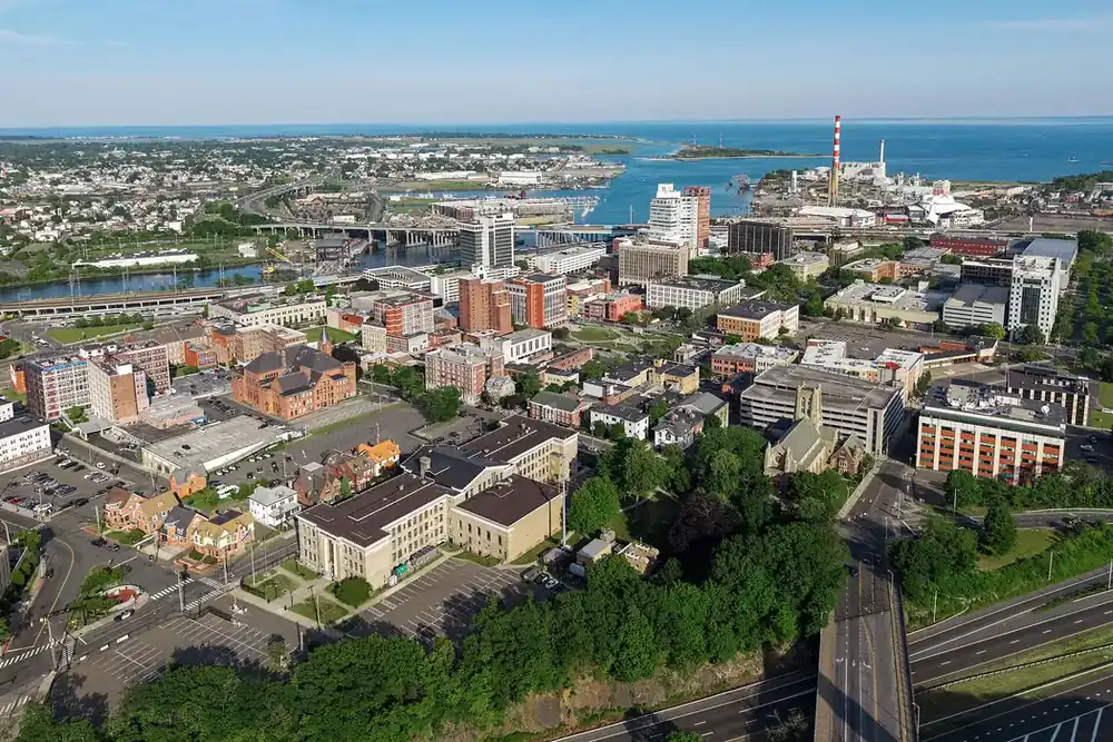 Aerial view of downtown Bridgeport, Connecticut, with the harbor and Long Island Sound beyond