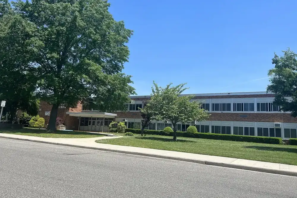 Park Avenue Elementary School, a long brick building behind a green lawn in North Bellmore, New York