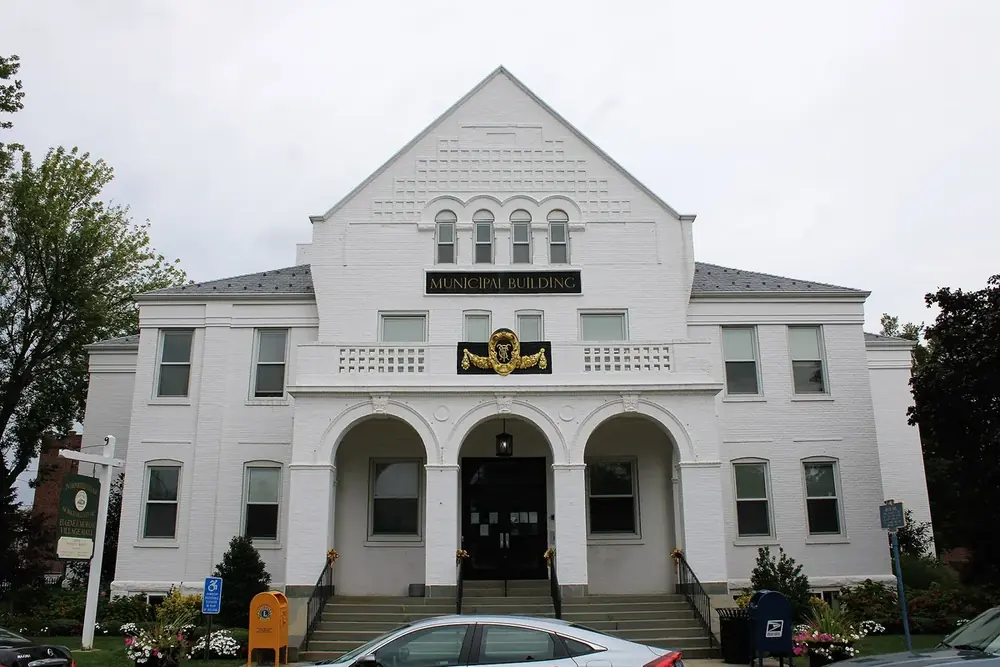 Eugene J. Murray Village Hall, a white building with arched windows in Rockville Centre, New York