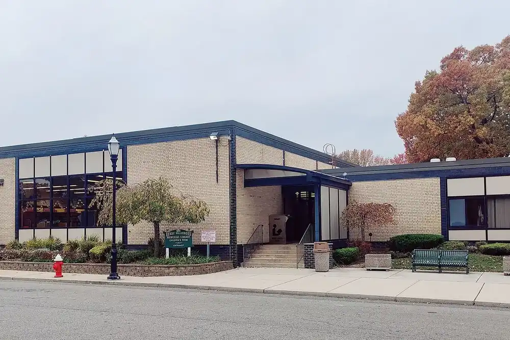 Henry Waldinger Memorial Library, a low brick building with a front sidewalk in Valley Stream, New York